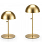 Two gold-finished metal dome-shaped jewelry stands on a white background.