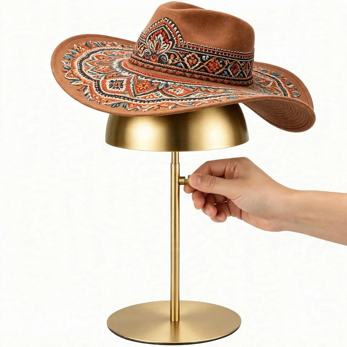 Brown embroidered boho wide-brim felt hat displayed on a gold metal stand