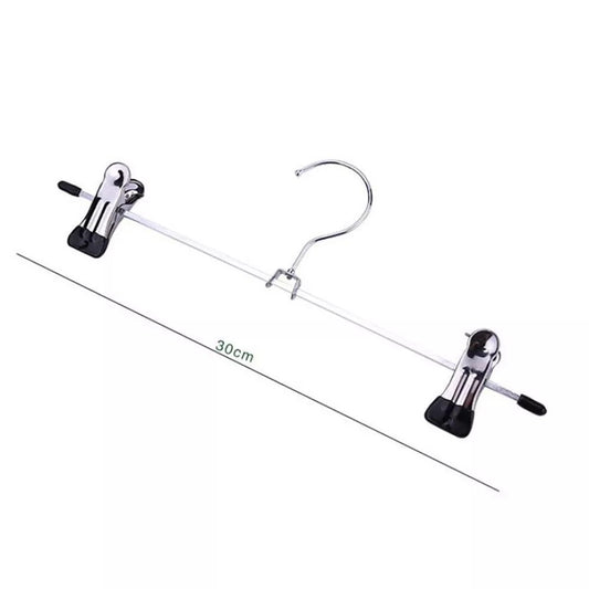 Set of metal hangers with clothes on a white background - textile care - vintage clothing - wardrobe hangers 